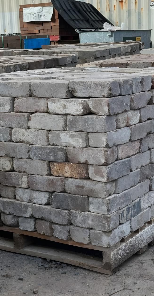A Pile Of Bricks Stacked On Top Of Each Other On A Wooden Pallet — Premier Bricks, Blocks & Pavers In Maitland, NSW