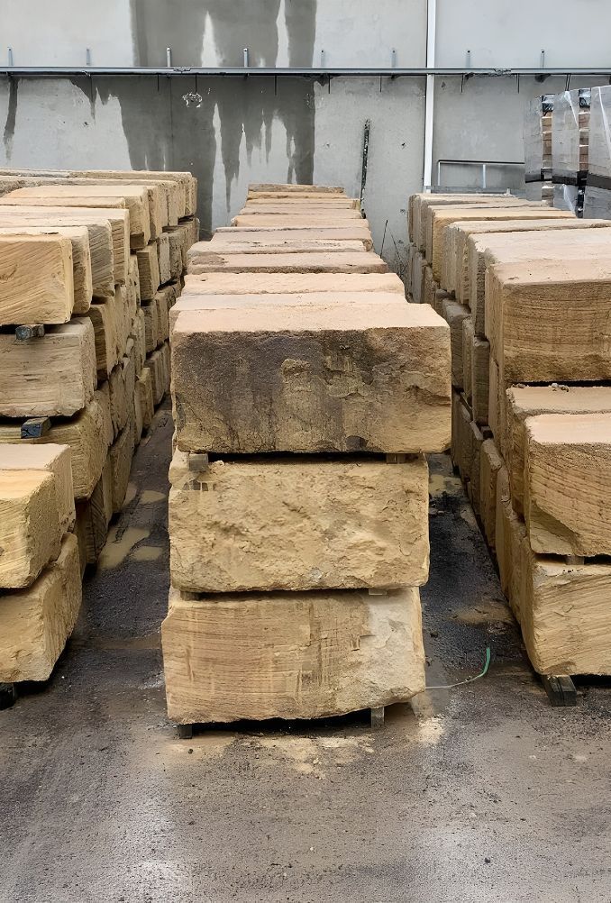 A Warehouse Filled With Lots Of Bricks Stacked On Top Of Each Other — Premier Bricks, Blocks & Pavers In Hawks Nest, NSW
