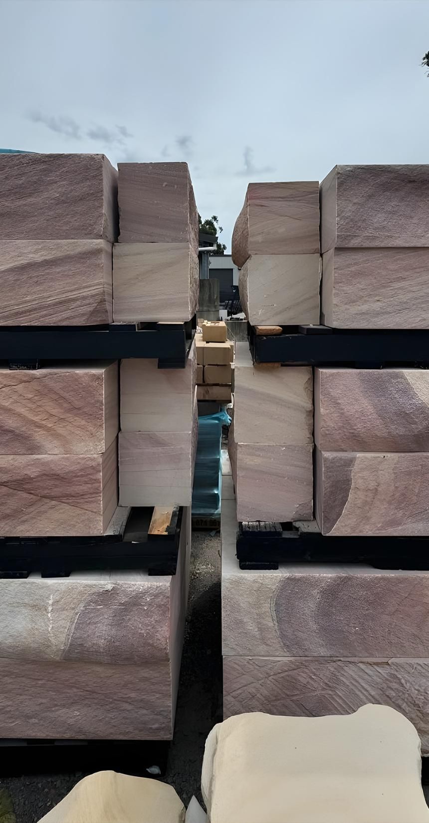 A Pile Of Wooden Blocks Stacked On Top Of Each Other — Premier Bricks, Blocks & Pavers In Maitland, NSW