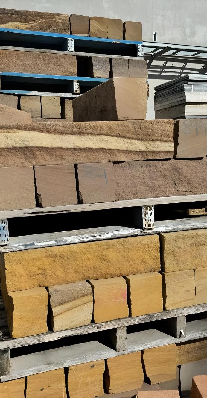 A Bunch Of Bricks Are Stacked On Top Of Each Other On Pallets — Premier Bricks, Blocks & Pavers In Port Stephens, NSW