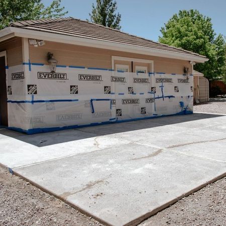 A building with a lot of tape on it that says everlast