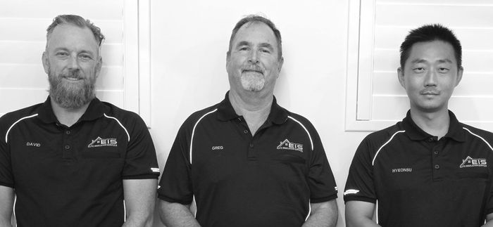Three members of the Elite Insulation Services team in branded polo shirts