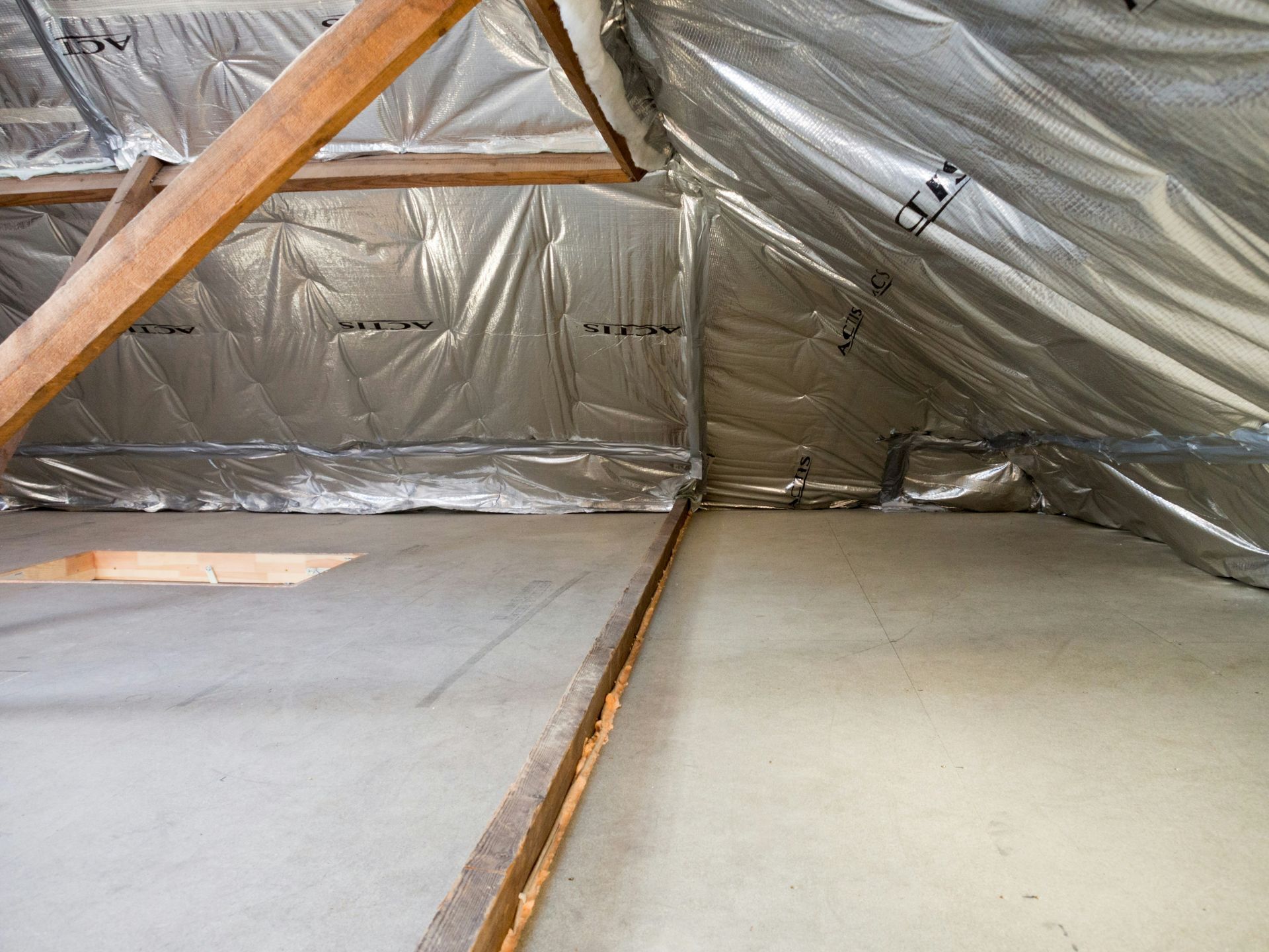 Reflective foil sarking lining the underside of a roof in a residential roof space