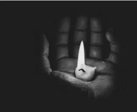 Hand Holding a Candle Hand Holding a Candle