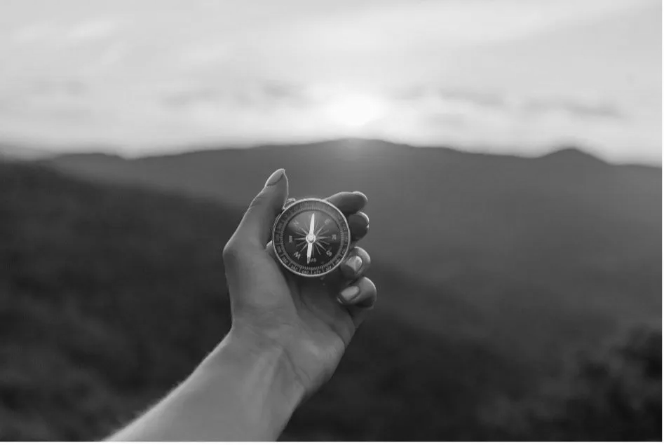 Man Holding a Compass