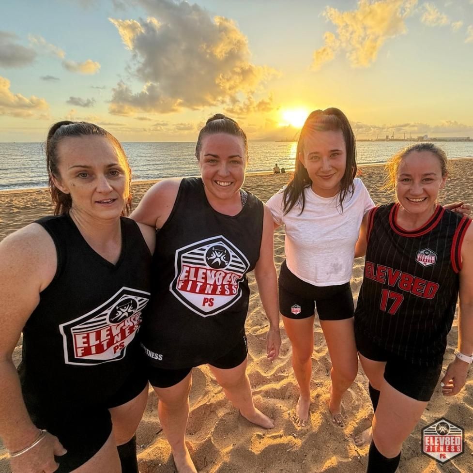 A Group Of Women Are Posing For A Picture On A Beach — Elev8ed Fitness In Currajong, QLD