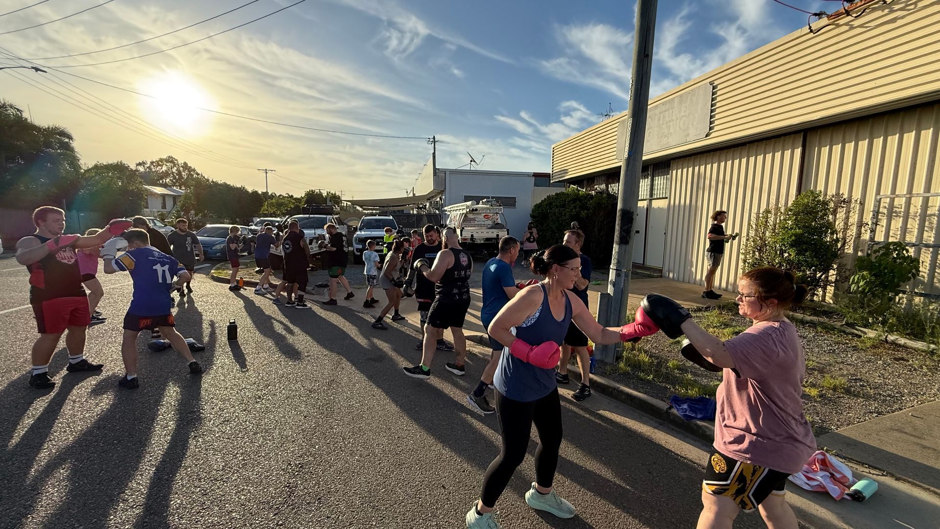 A Group Of People Are Boxing Outside — Elev8ed Fitness In Currajong, QLD