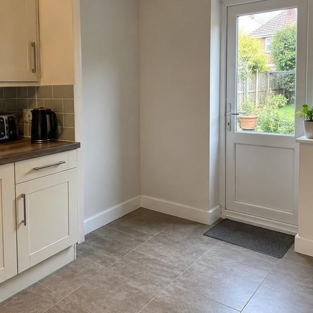 After: the same kitchen with the fridge freezer gone