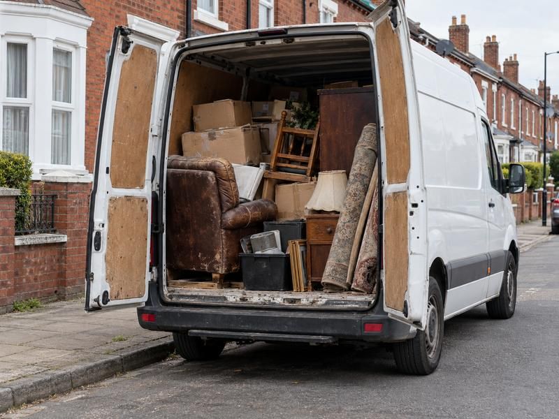 Van loaded with furniture and boxes after a house clearance