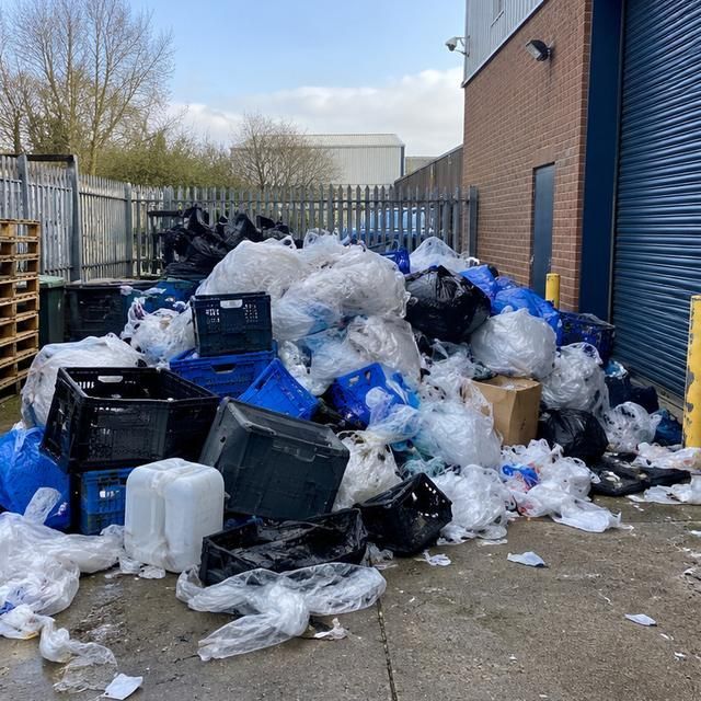 Before: bags of plastic and crates piled in a yard