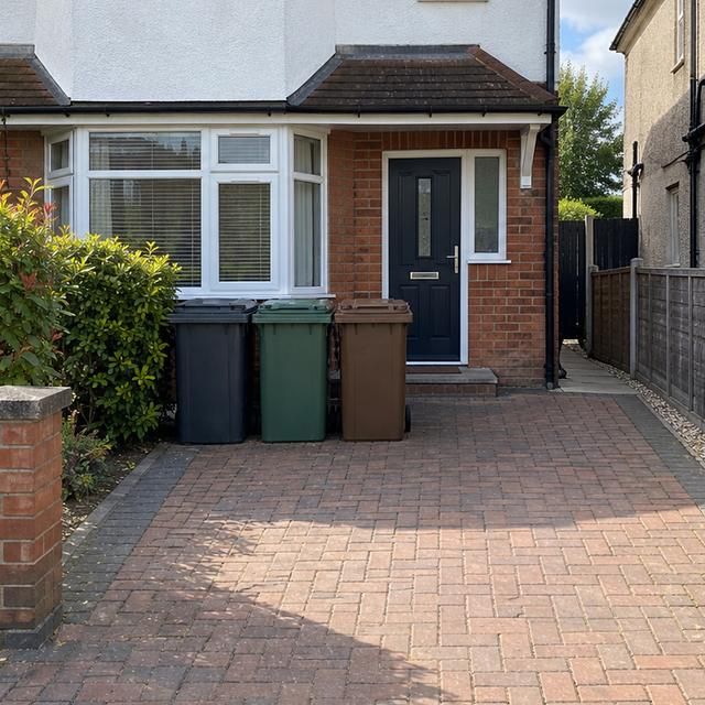 After: the same bins emptied and the driveway clear