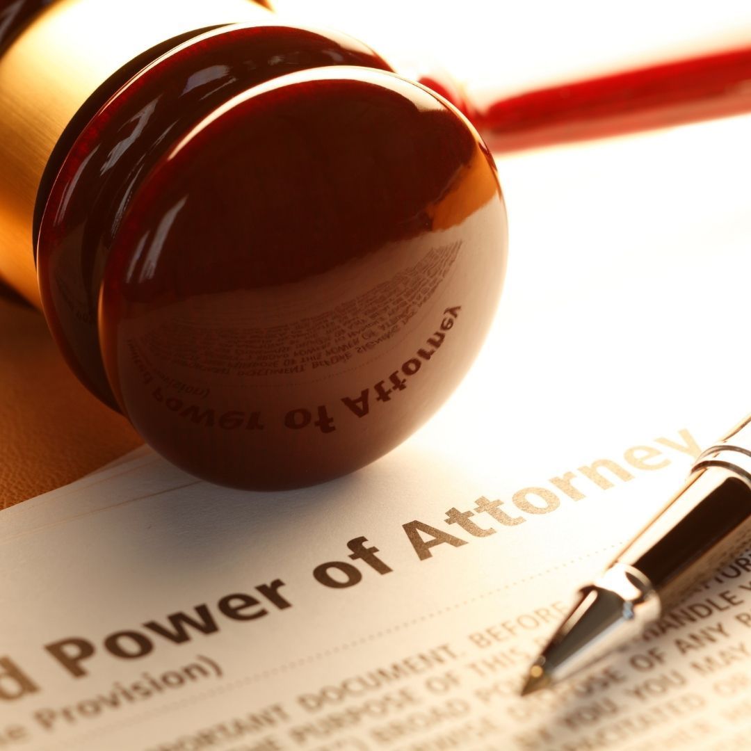 A gavel, pen, and document titled 