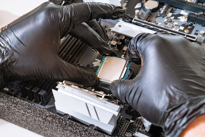 Professional Technician Replacing Computer Processor