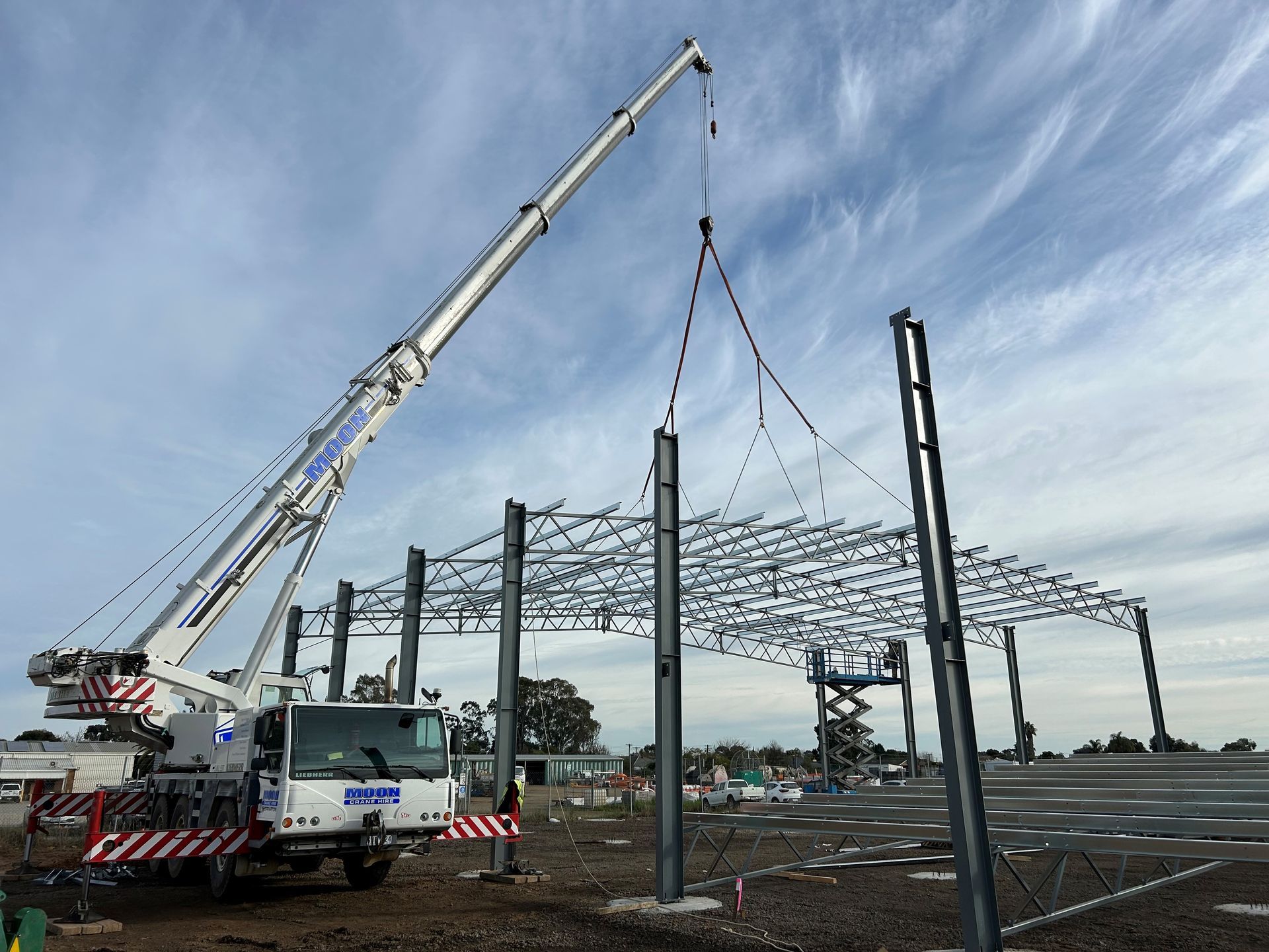 Image of Two Crane Truck Lifting Roof Trusses — Shepparton, Vic — Moon Crane Hire