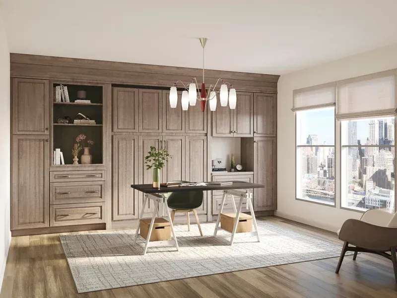 Modern dining room with built-in wood cabinets, round table, white rug, and large windows overlooking a city.