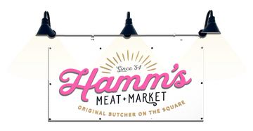 A hamm 's meat market sign is hanging from the ceiling.