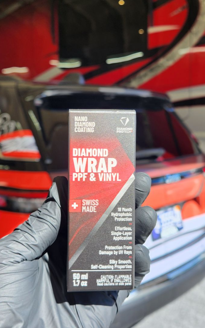 Jeep Grand Cherokee in custom wrap receiving a special ceramic coating for wrap by 6 Speed Mobile Detailing in Southwest Florida