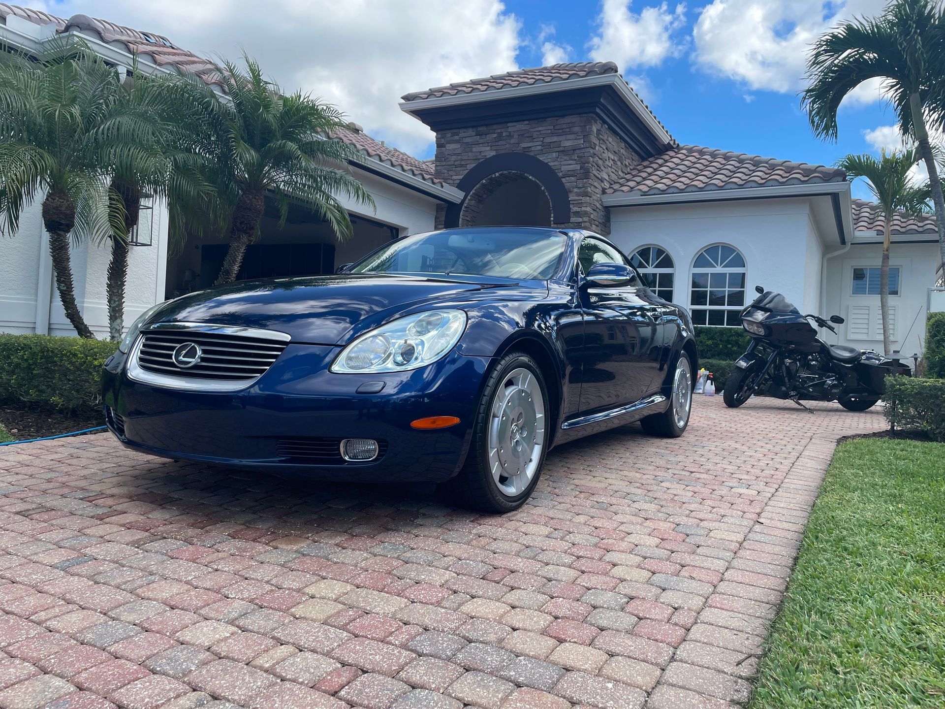 Lexus SC430 and Harley Davidson motorcycle, both receiving our ceramic coating by 6 Speed Mobile Detailing in Southwest Florida