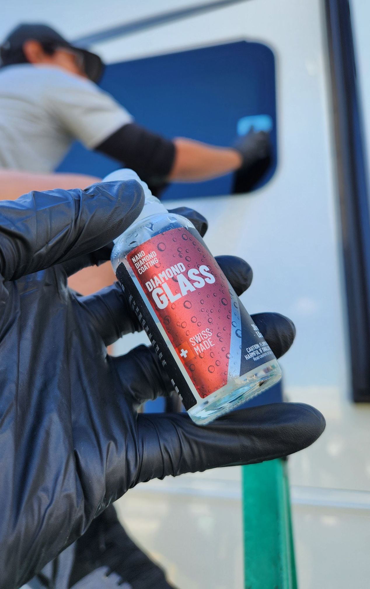 Person holding a bottle of 