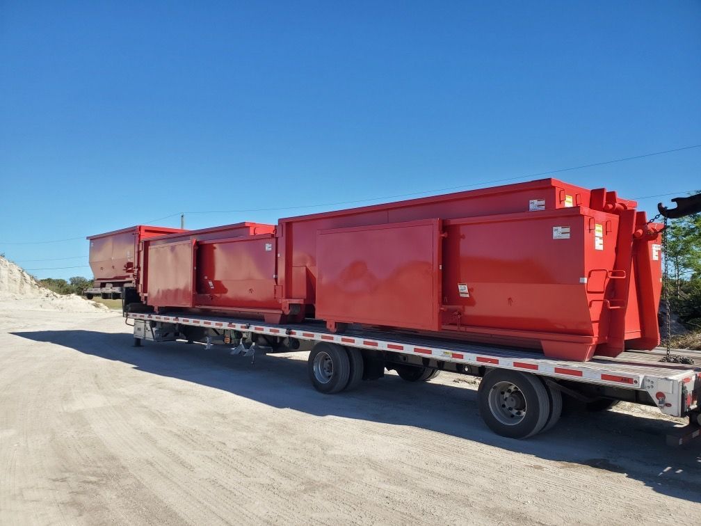 Dumpsters on a Flatbed — Melbourne, FL — Braggs Roll-Off Dumpsters Inc.