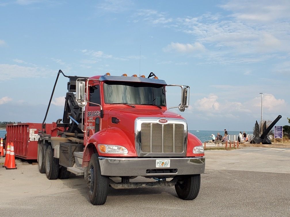 Roll-off Dumpster Truck — Melbourne, FL — Braggs Roll-Off Dumpsters Inc.