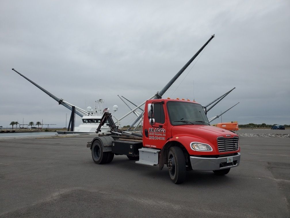 Bragg's Roll-Off Dumpster Truck — Melbourne, FL — Braggs Roll-Off Dumpsters Inc.