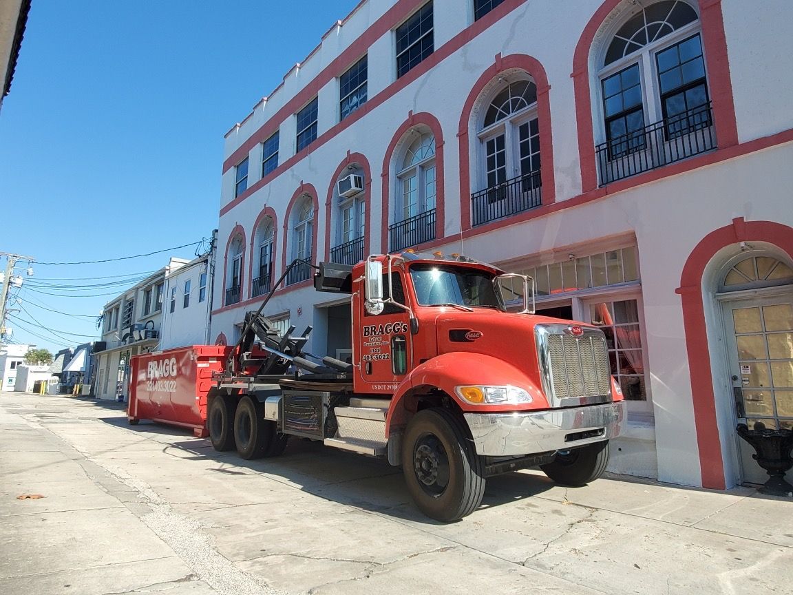 Red Dumper Trailer — Melbourne, FL — Braggs Roll-Off Dumpsters Inc.