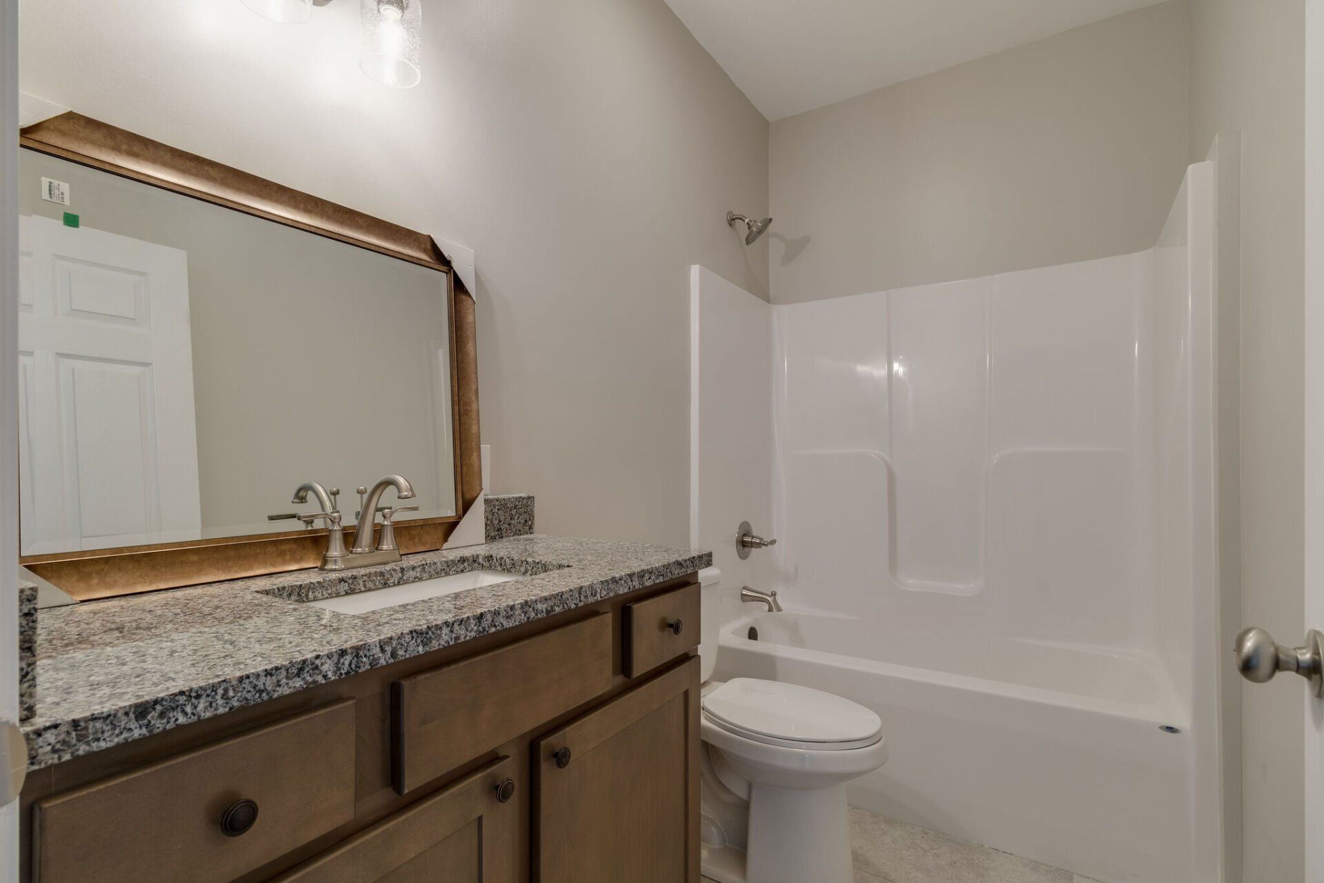 bathroom with shower and tub