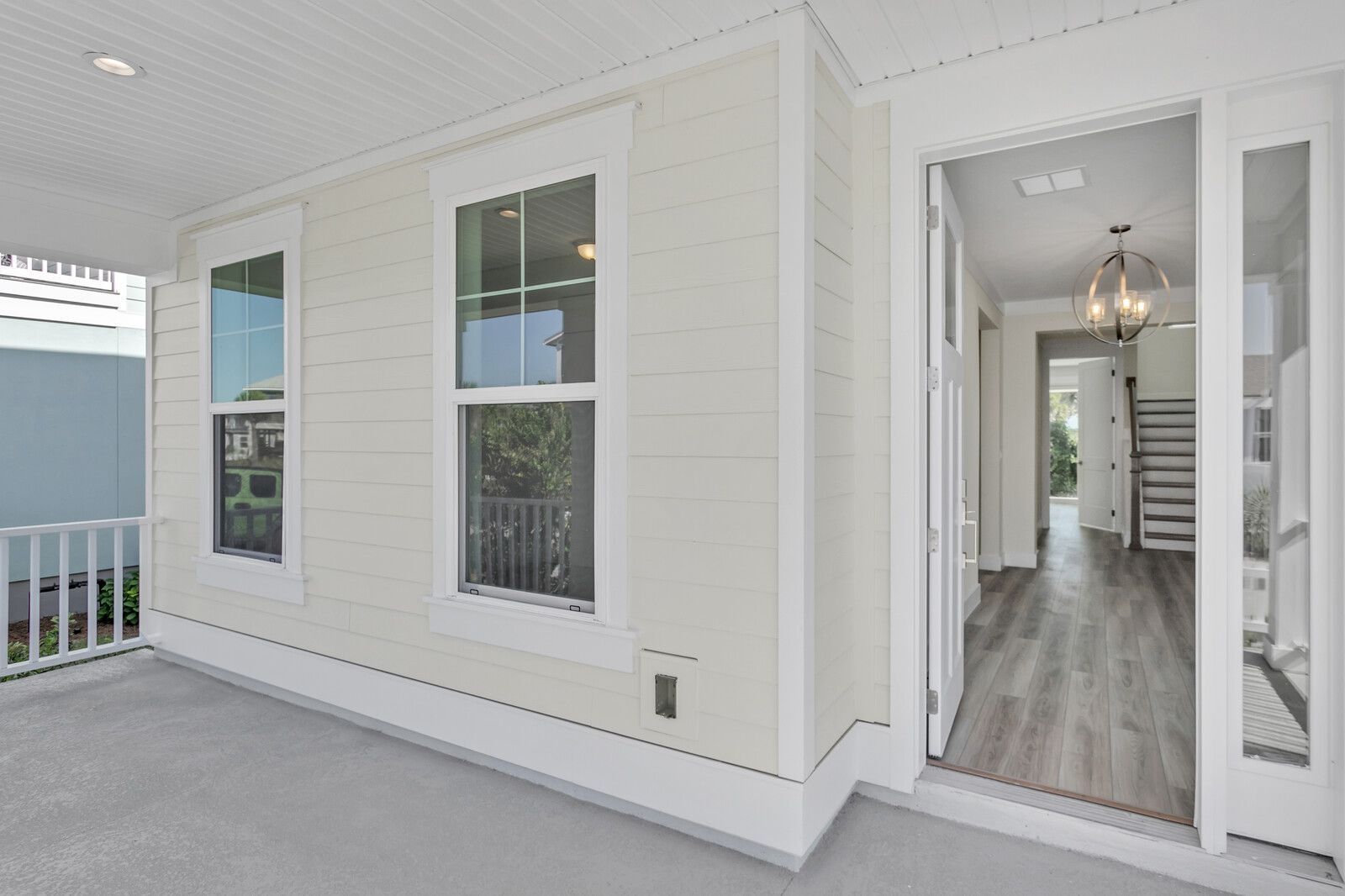 A white house with a porch and a hallway