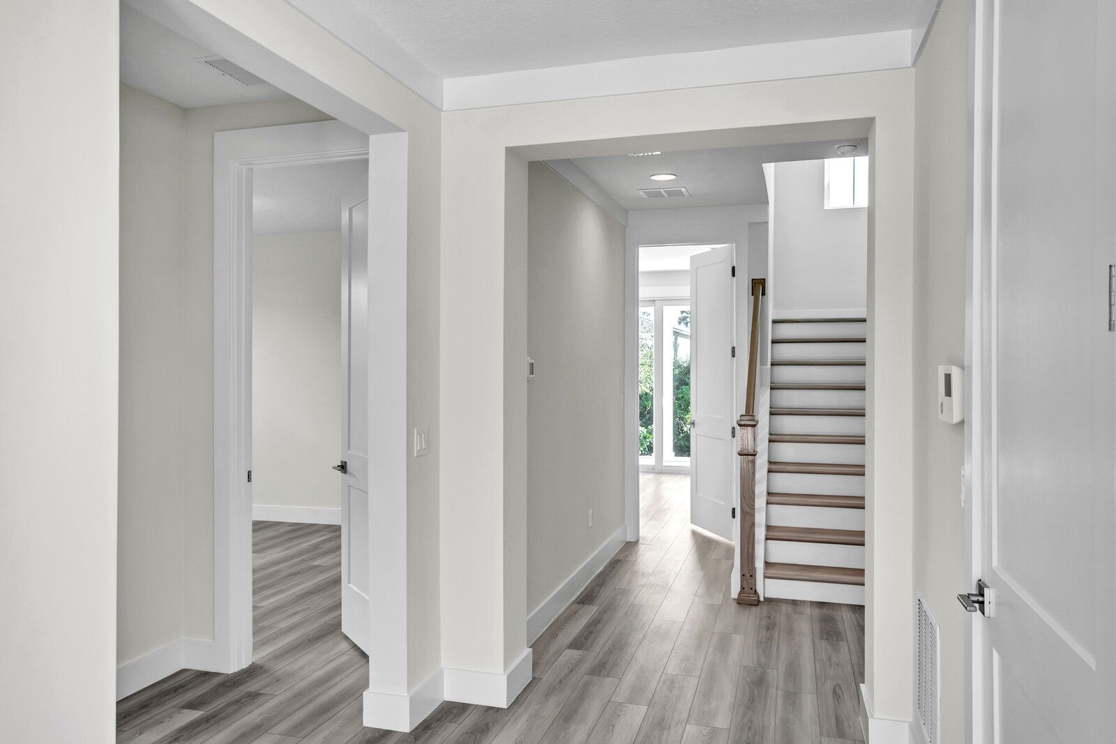 There is a staircase in the middle of the hallway.