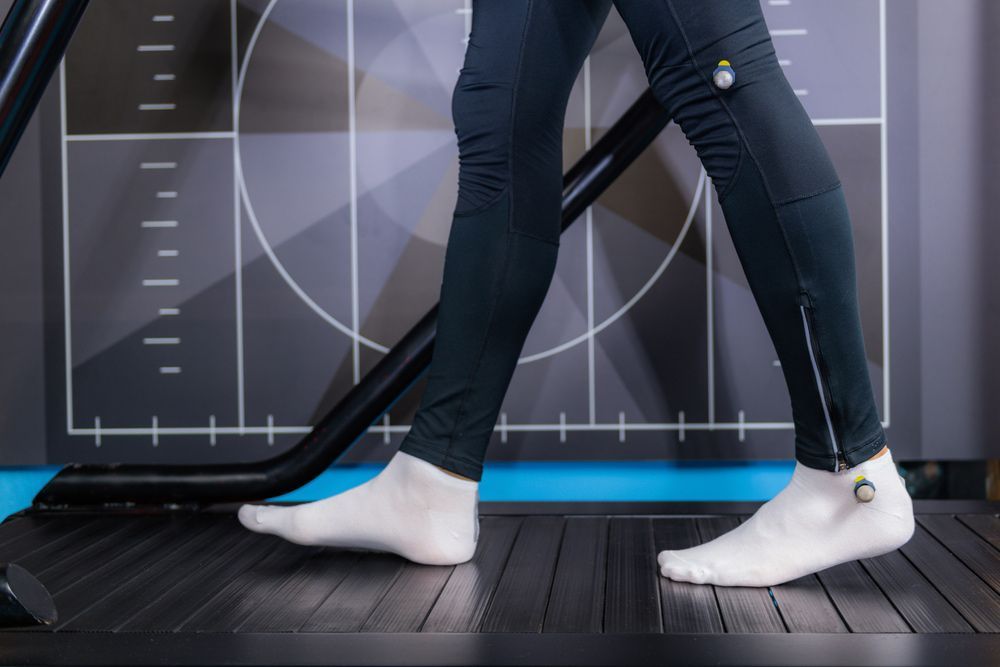 A Person Wearing A Pair Of White Socks Is Walking On A Treadmill — Sandy Gugenberger Podiatrist in Port Macquarie, NSW