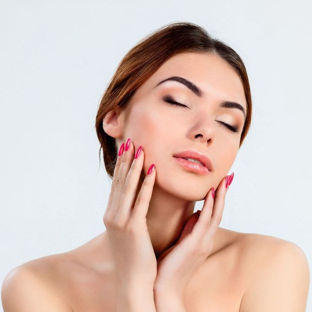 Woman with red nails at ERA Wellness Spa in Georgetown, KY