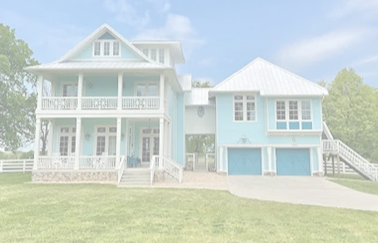 a large blue and white house with a white roof
