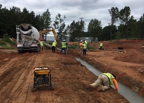 A group of construction workers are working on a construction site.