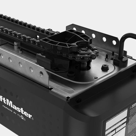 Close-up of a black LiftMaster garage door opener with a chain-drive mechanism.