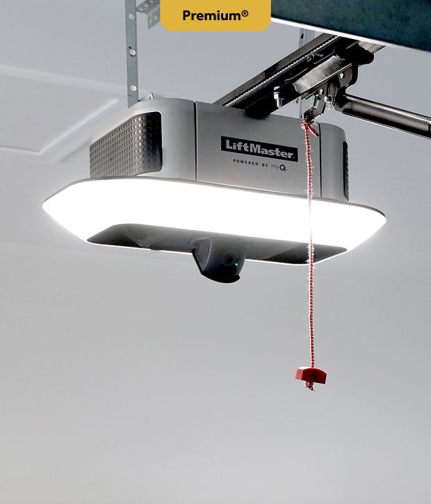 LiftMaster garage door opener with integrated light and pull cord, mounted on a ceiling.
