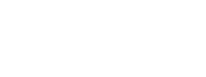 A modern white electric toothbrush sits upright on its circular, gray charging base.