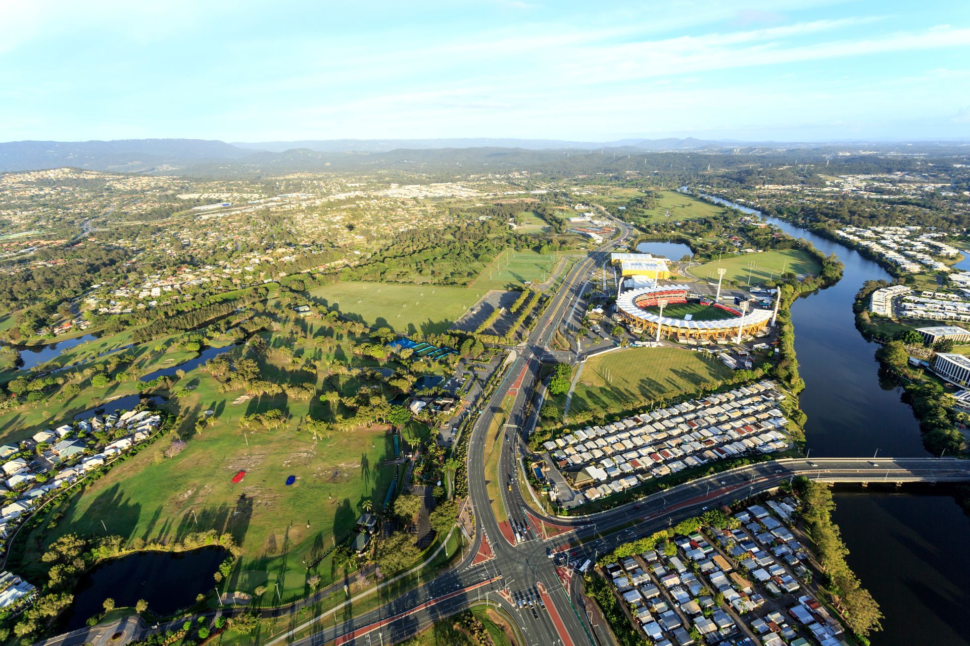 An Aerial View of a City With Tall Buildings and a Beach — NDR Trade Solutions in Carrara, QLD