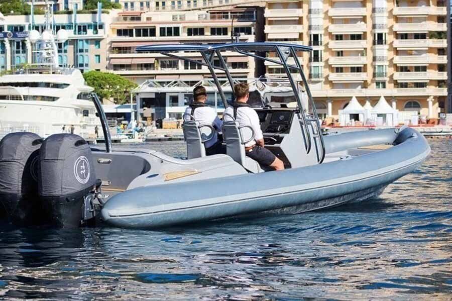 A boat is floating on top of a body of water.