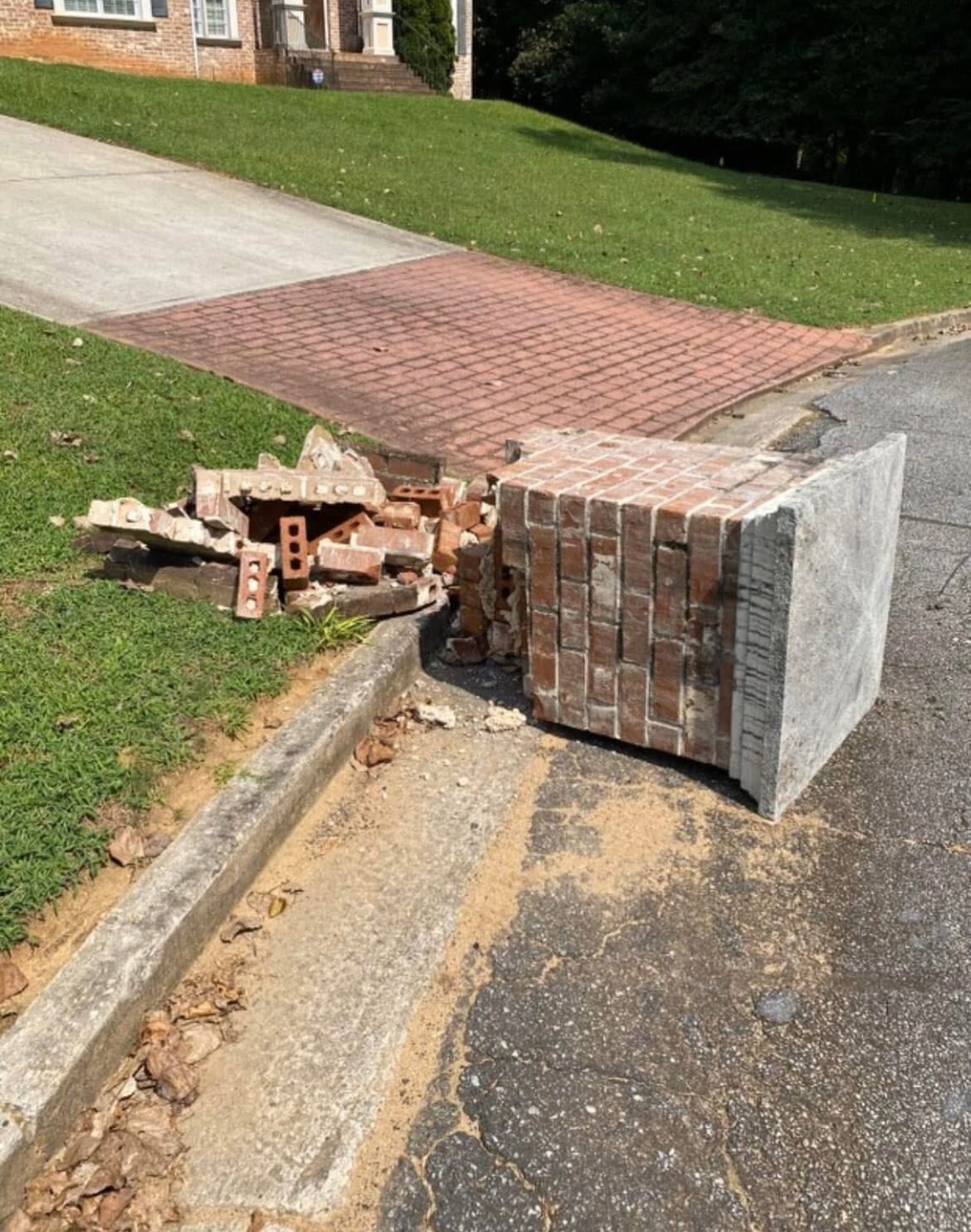 brick mailbox knocked over by car
