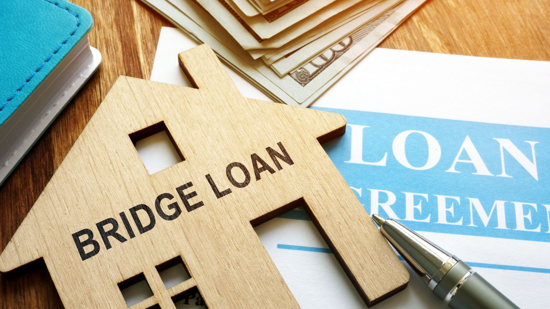 A wooden house with the words bridge loan written on it