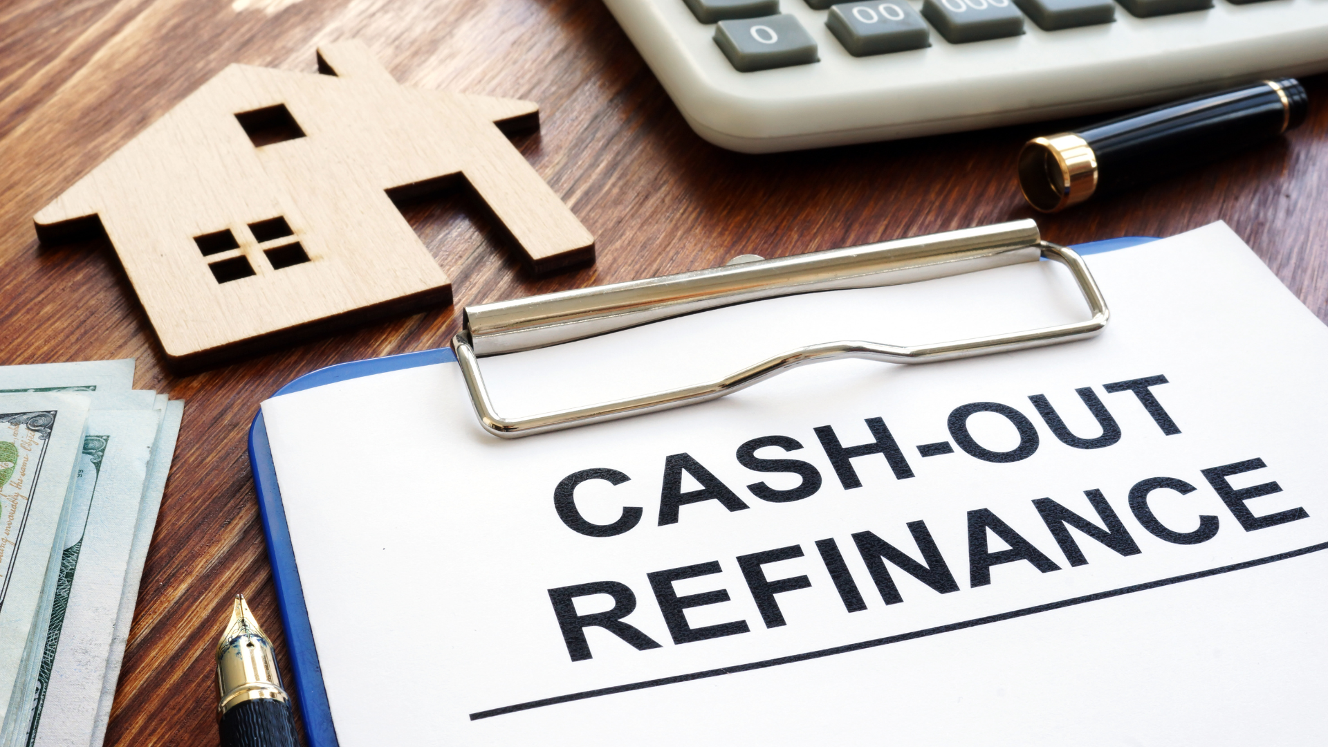 A clipboard with the words cash-out refinance written on it.