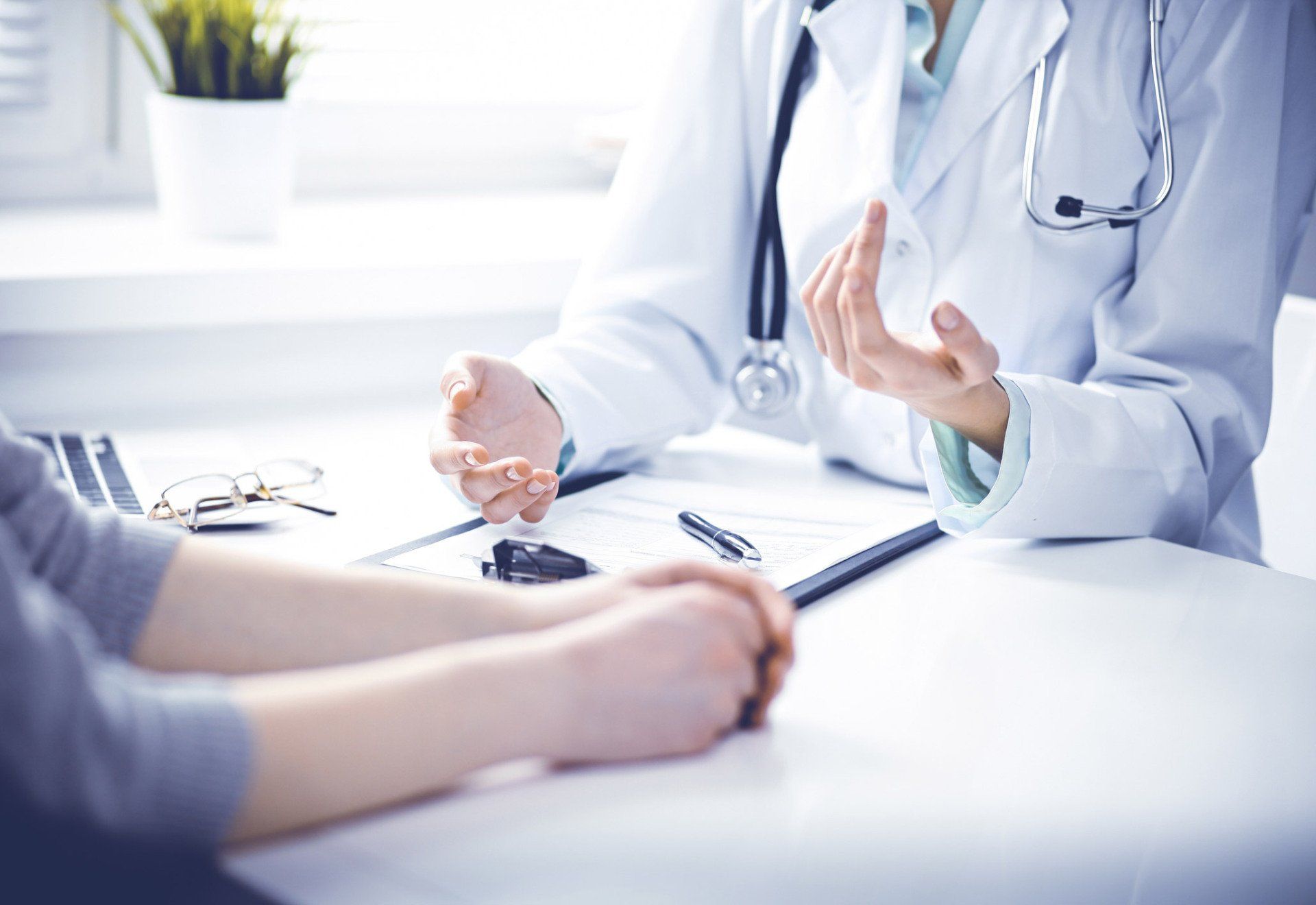 Doctor And Female Patient — Peoria, IL — Illinois Work Injury Resource Center Doctor And Female Patient — Peoria, IL — Illinois Work Injury Resource Center