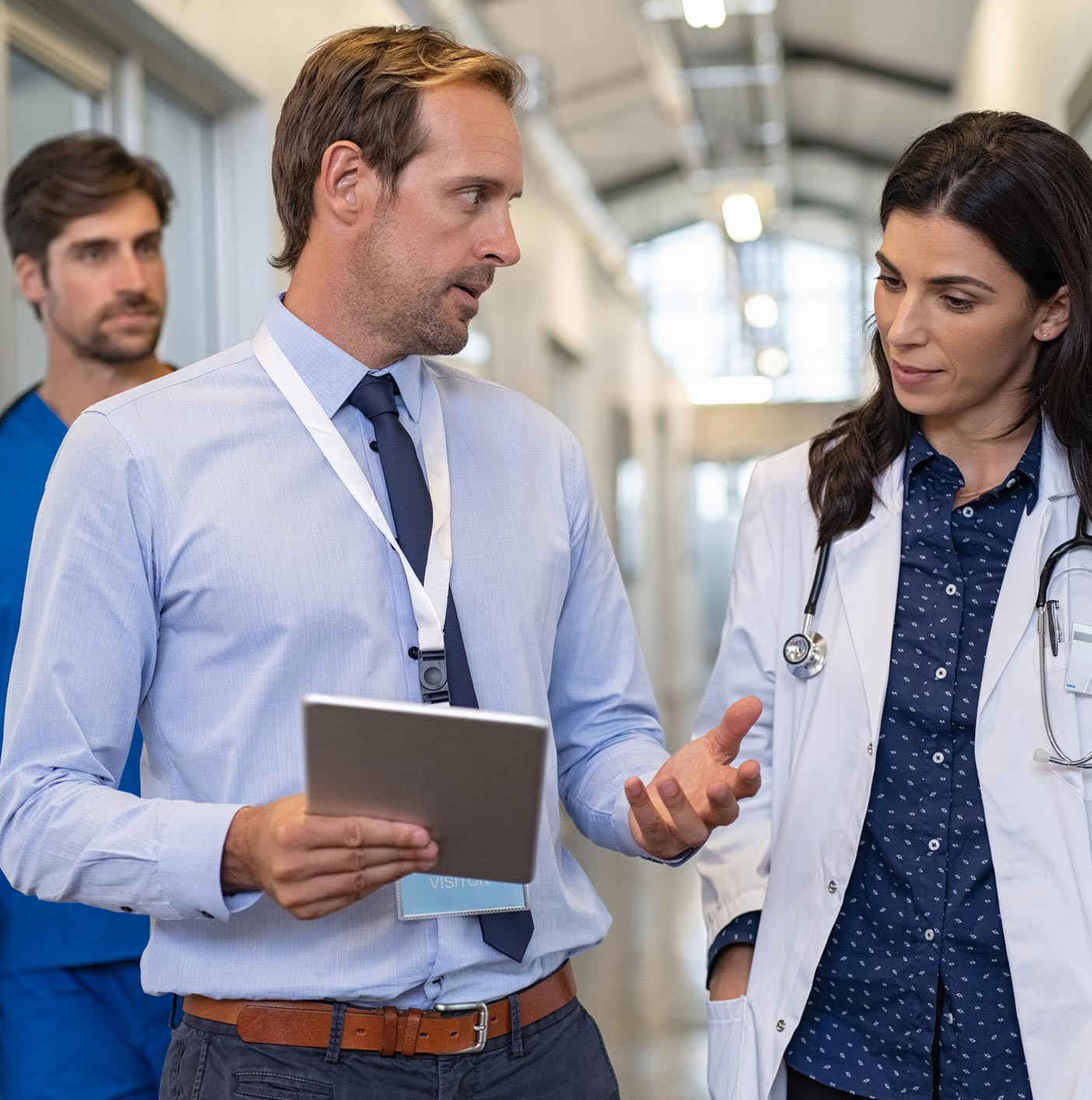 Man And Woman Doctor Talking — Peoria, IL — Illinois Work Injury Resource Center Man And Woman Doctor Talking — Peoria, IL — Illinois Work Injury Resource Center