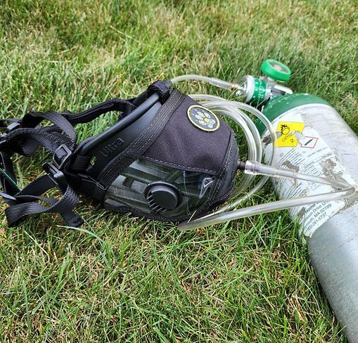 Barrett O2 Muzzle detail — silicone seal, oxygen port, and strap hardware