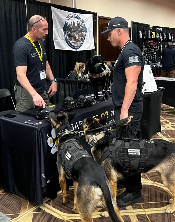 K9 handler with dog receiving oxygen via Barrett O2 Muzzle