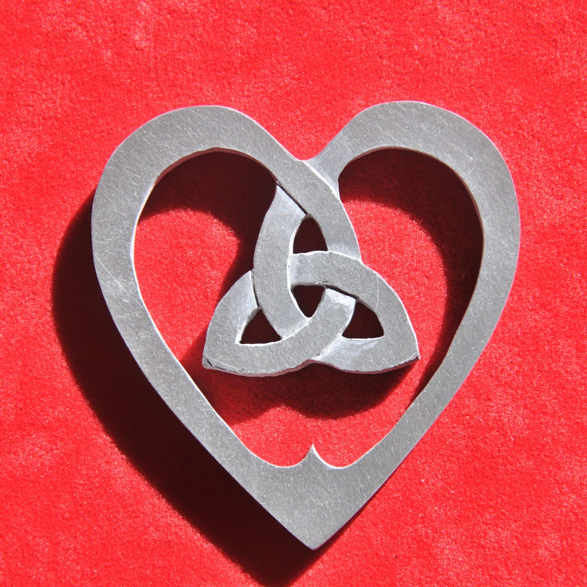 Hand cut and engraved celtic knot inside a heart made from Devonian mudstone, made in Porthleven, Helston by Slate of the Art