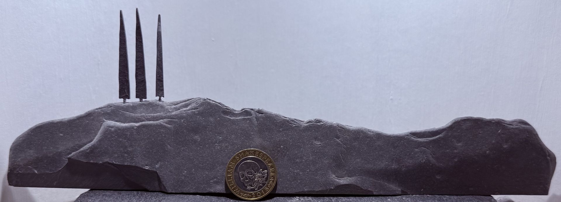 3 Tiny Tall Trees on a Hill with £2 coin for scale 3 Tiny Tall Trees on a Hill