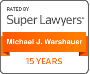 A badge that says `` rated by super lawyers michael j. varshauer 15 years ''