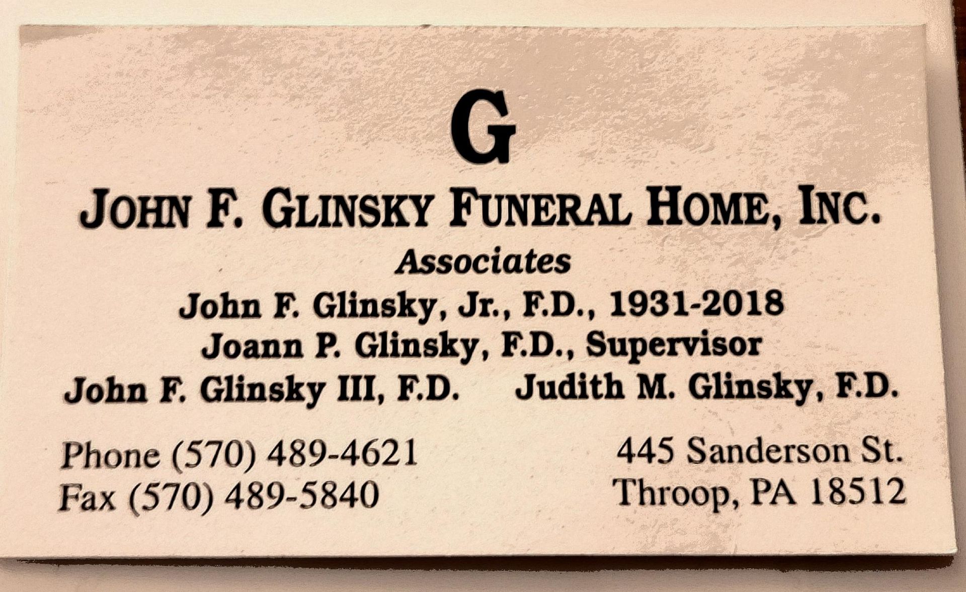 John F. Glinsky Funeral Home, Inc. business card with services, phone numbers, and Troop, PA address.